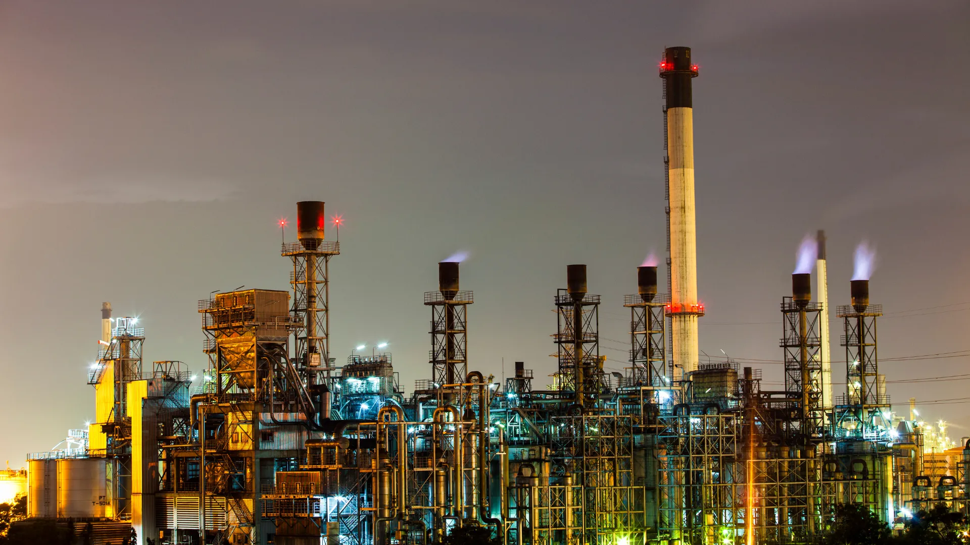 Modern oil refinery at dusk